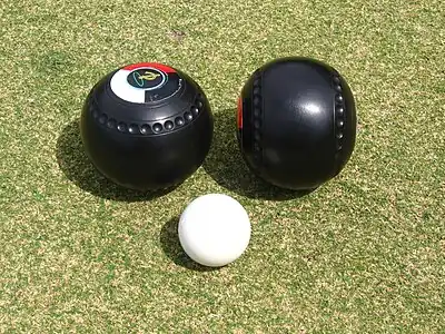 Two lawn bowls and the kitty (or jack)