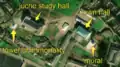 3/7 Another city centre with a mural (tourism=artwork and artwork_type=mural), recognisable because it has the shape of a wall that leaves a shadow on the ground, with no building in the immediate vicinity, a juche study hall (amenity=community_centre), with its specific shape, the Tower of Immortality (historic=memorial and memorial=immortality_tower), with its shadow on the ground, and the Town Hall (amenity=townhall) (Maxar satellite imagery).