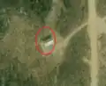 8/8 Communication tower (man_made=tower and tower:type=communication), with an antenna and a small building, on top of a mountain (Maxar satellite imagery).