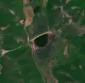 3/6 Dam (waterway=dam) holding back water from a reservoir (Maxar satellite imagery).