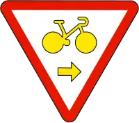 Cyclistes autorisés à tourner à droite en cédant le passage (M12a)