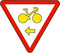 Cyclistes autorisés à tourner à droite en cédant le passage (M12c)