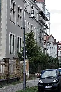 Spitzbogenmast mit Stahlsockel mit 9-fl. Hängeleuchte BAMAG A11