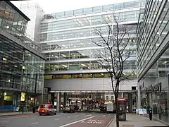 Commercial building across a big road (skipping ground floor). See on OSM