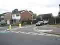 Give way markings without an upright sign are commonly used on minor road junctions in the UK and the node could be additionally be tagged with traffic_sign=GB:1003A