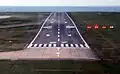 The PAPI can be seen to the right of the runway. The plane is below the glideslope.