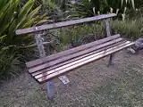A bench with a damaged backrest amenity=bench abandoned:backrest=yes