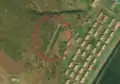 1/3 Giant slogan composed of a sign system each korean (hangeul) character (Maxar satellite imagery).