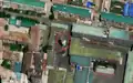 3/4 Storage tank (man_made=storage_tank) in a highly urbanised centre with a mural (tourism=artwork and artwork_type=mural) and a monument (historic=memorial) (Maxar satellite imagery).