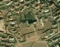 1/4 Electrical substation (power=substation) in the middle of a city that stands out with many shadows cast over a small area (Maxar satellite imagery).