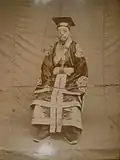 Official wearing sacrificial clothing.