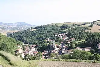 The church and surrounding buildings in Courzieu