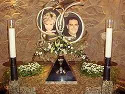 Previous memorial in Harrods, featuring framed portraits between candles