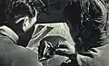 Student of BCCM learns to differentiate Asian ginseng from other herbs. March 1963, People's Pictorial.