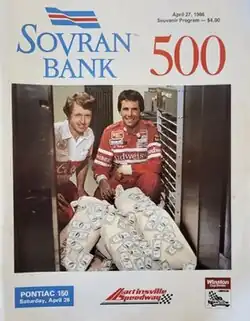 The 1986 Sovran Bank 500 program cover, featuring Bill Elliott and Darrell Waltrip robbing a bank.