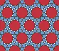 Another compact packing of two sizes of circle