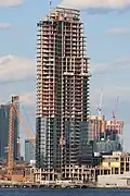 Building under construction in March 2017, viewed from Manhattan.