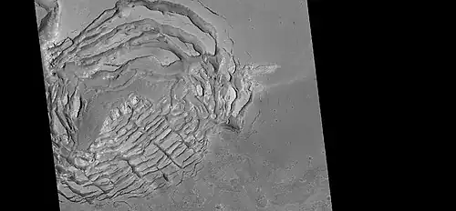Large group of concentric cracks, as seen by HiRISE, under HiWish program Location is Ismenius Lacus quadrangle. Cracks were formed by a volcano under ice.[125]
