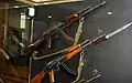 An AK-47 Type 1 (top) and 2 (bottom) on display. The Type 1 features a stamped receiver while the Type 2 receiver is milled.