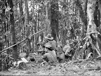 Australian soldiers man a defensive position in the jungle