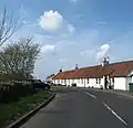 A row of white-washed cottages at Kingston