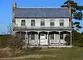An abandoned and decaying example of Southern American rural vernacular architecture commonly seen in the 1800s and 1900s, surviving well into the 21st century