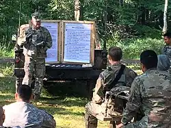 1-337 conducting an After Action Review for an Army Reserve unit at Camp Ripley during CSTX 86-17-03