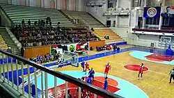 Al-Assad Sports Arena interior during a match