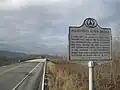 Historical marker near Dewart, with the replacement bridge behind