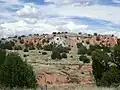 Horizontal Ancha Formation beds resting on nearly vertical Galisteo Formation beds.