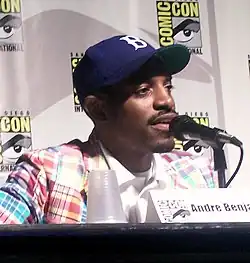 A man speaks to a microphone at the San Diego Comic Con.
