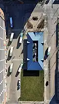 A view from above of the Appleton Transit Center with buses meeting during the hourly pulse period.