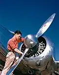 Mechanic with Lockheed Model 12 Electra Junior in 1940