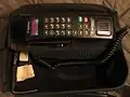 Motorola Digital Concert bag phone with color LCD display, in upright bag.