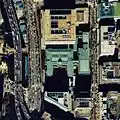 Aerial view (1984) with original building and eastern extension (green roofs), new building (top), and southern annex (bottom left)