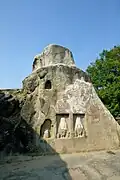 Buddhist reliefs on the outside of Karna Chaupar.