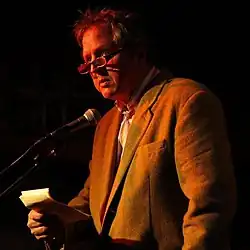 Warner at a poetry reading