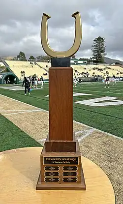 The present-day Battle for the Golden Horseshoe trophy is shown in San Luis Obispo, California in 2023 before the annual college football rivalry game between Cal Poly and UC Davis.