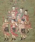The dignitaries in blue robes are probably Mani’s father Badi, and five standard bearers