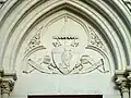 Coat of arms on the south door of the St. Nicolas basilica in Nante.