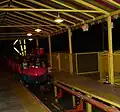Inside the line queue as the train passes by (backwards)