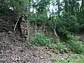 A large brick retaining wall behind the site of the blast furnaces.