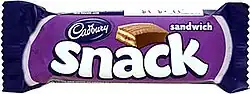 Candy bar in purple-and-black wrapper