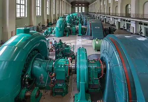 Image 8 Walchensee Hydroelectric Power Station Photograph credit: Diego Delso The Walchensee Hydroelectric Power Station is a storage power station in Bavaria, Germany. The turbines, seen here, are fed by water from the Walchensee which is then released into the Kochelsee. The power station uses the hydraulic head of about 200 metres (660&nbsp;ft) between the two natural lakes, and water from the Rißbach river is also used to augment the supply. The installed capacity is 124 MW with an annual production of 300 GWh; this is one of the largest of such power plants in Germany. More selected pictures