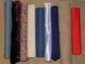 A variety of contemporary fabrics. From the left: evenweave cotton, velvet, printed cotton, calico, felt, satin, silk, hessian, polycotton.