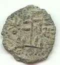The reverse of the tree and swastika coin