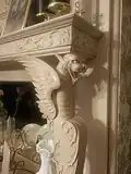 One of the two carved griffons