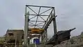 Approximately 250 tons being unloaded into the crusher.