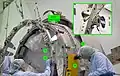 Powered Bolt upper housings are shown in this pre-flight test of the Cupola from late 2008. Actuators are not used in this equipment. Engagement of strikeplates (1) with thermal standoffs (2) and alignment pins (3) with sockets (4) is imminent. The inset, from a photo taken two years later, shows the back of the Powered Bolt Assembly's Upper Housing.[6][118]