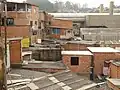 The roofs have in the meantime all been sealed, the houses have foundations and solid walls.